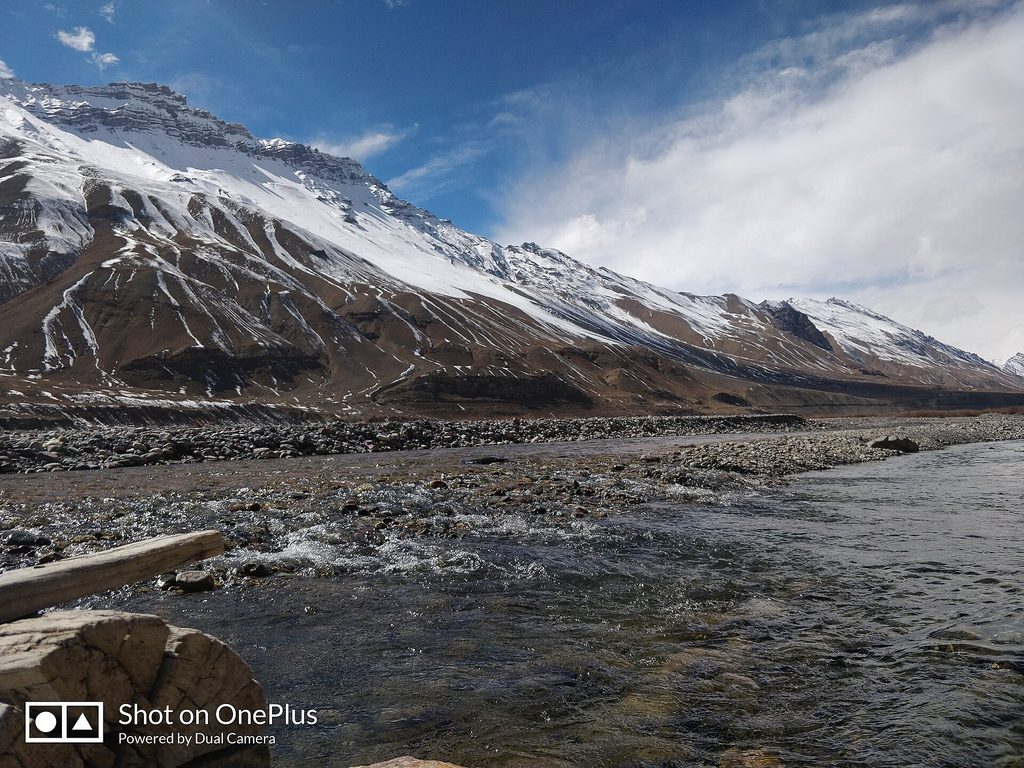 Snow-covered mountains and Spiti River during winter in Himachal Pradesh.